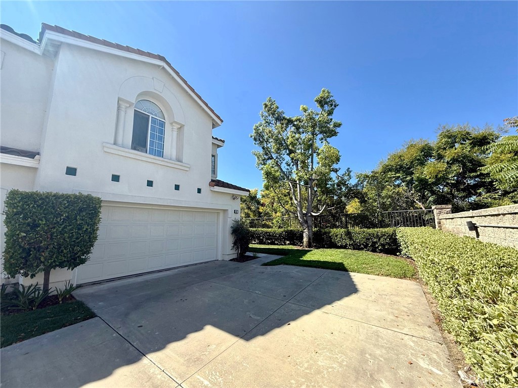 Former model home on private corner lot in the desirable gated community of Eagle Point. This spacious home is offered by the original owner and has over 2,160 sq. ft. of living space with 4 bedrooms, downstairs is currently used as an office with a closet, a large loft, and 3 full bathrooms — offering both flexibility and comfort.
This beautiful home is filled with loads of natural light and has a great floor plan, vaulted ceilings, dining room with huge wall of mirrors, luxury vinyl flooring downstairs, dual-pane windows, plantation shutters and the home has been re-piped in PEX piping. Remodeled kitchen offers abundant storage with pull-out shelves, granite counters, stainless steel appliances, all a chef’s delight. Upstairs is the large loft and laundry room, two bedrooms and shared bath with dual sinks. The private primary suite features a spacious bath with dual sinks, walk-in shower, separate soaking tub, and a walk-in closet with custom built-ins.
A convenient 2-car attached direct-access garage has added storage, ample driveway parking and the backyard offers privacy, views, shade and great space for entertaining or dining al fresco. Eagle Point residents enjoy the community pool and spa in a secure gated setting. The location offers easy access to nearby Aliso Viejo parks, golf, aquatic center, award winning schools, hiking and biking trails, shopping, dining and all Town Center offers as well as great commuter access.
This is Aliso Viejo living at its best—don’t miss your chance to call this home yours!