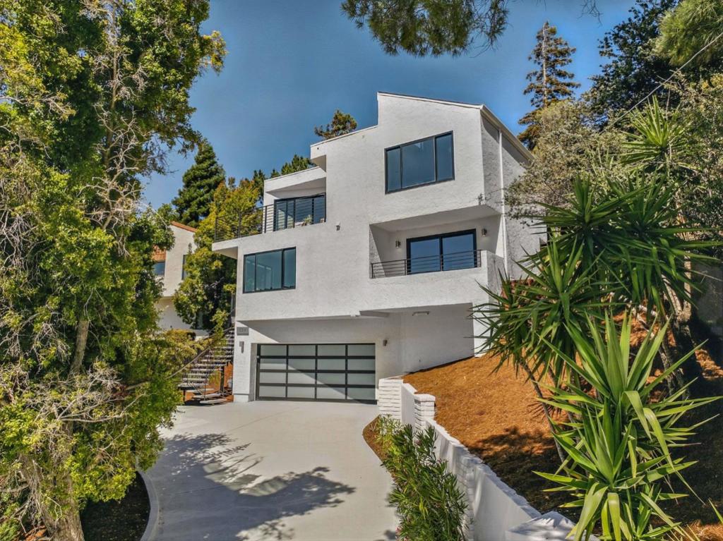 Stunning Contemporary 5 Bedroom, 3.5 Bath, 2760 SF San Carlos Home with panoramic views. Welcome to your dream home in the heart of San Carlos! This meticulously remodeled and fully redesigned contemporary masterpiece offers the ultimate in luxury, style, and modern conveniences. No detail has been overlooked in this high-end renovation from its elegant designer finishes to its cutting-edge smart home features, this home truly has everything you could ask for. Step into an open-concept living space flooded with natural light, highlighted by sleek lines, and top-of-the-line materials throughout. The gourmet kitchen is a chefs dream, featuring Thermador appliances, custom cabinetry, quartz countertops, and a spacious island perfect for entertaining. Enjoy the seamless integration of smart living with designer smart switches, smart thermostat, and app-controlled lighting and Ring Door camera all designed to enhance comfort, energy efficiency, and peace of mind. The luxurious primary suite offers a spa-inspired bath tub with premium fixtures, designer tile, and ample closet space. Every bathroom has been upgraded with modern vanities and high-end finishes that reflect impeccable taste and attention to detail. The back yard patio offers the perfect location to host guests.