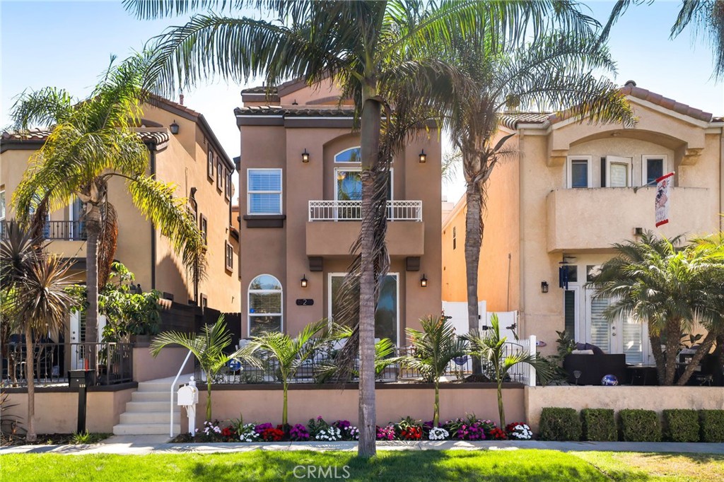 Nestled on one of the quietest, most upgraded, and coveted streets in the heart of Downtown Huntington Beach, this stunning three-level residence is mere steps from the beach, one block from serene Lake Park, and a short stroll to vibrant Main Street, Pacific City, and award-winning schools. A spacious elevated front patio greets you, setting the stage for the bright, airy open floor plan within. The first floor seamlessly connects the living room, two outdoor entertaining areas, family room, kitchen, and dining area, all bathed in natural light. The modern kitchen shines with all-new appliances, a walk-in pantry, and a convenient laundry room. Ascend to the second level to find a generous family room with soaring high ceilings, a luxurious primary suite, and two additional Jack-and-Jill bedrooms, ideal for family or guests. The third level offers a versatile space with a private oversized balcony, perfect for relaxation or entertaining. Blending coastal charm with modern elegance, this home delivers the ultimate Huntington Beach lifestyle in an unparalleled location.