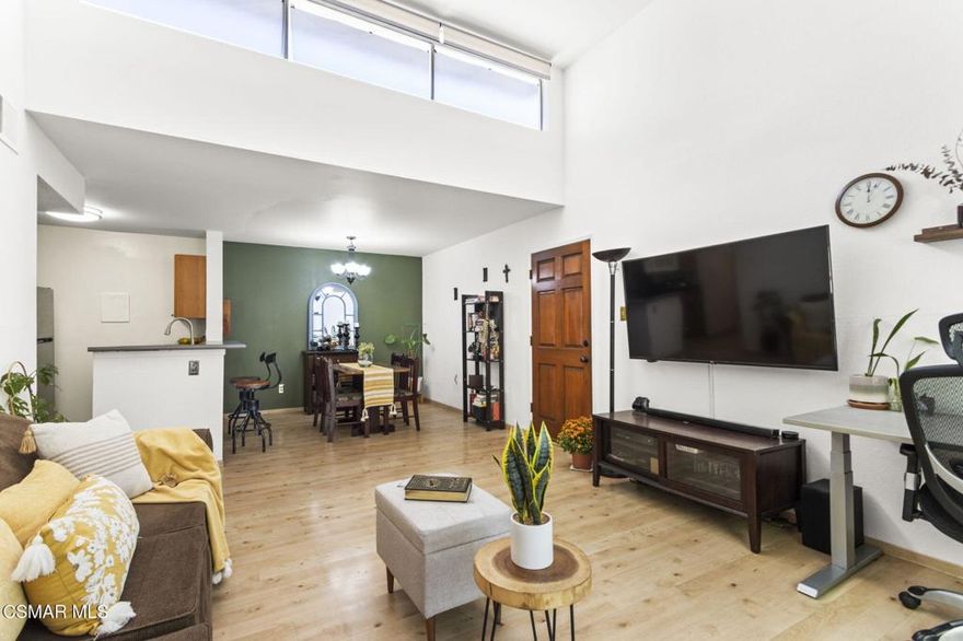 Welcome to this bright, light-filled top floor, 2 bedroom, 1 bath condominium in the sought-after California Village community! This stylish home features a spacious open floor plan featuring a kitchen that opens to a living room with vaulted ceilings and motorized curtains for the upper windows. The primary bedroom offers a walk-in closet and a private balcony provides serene tree-top views.Community amenities include a pool, jacuzzi, club house, gated entry with overnight security, and two side-by-side parking spaces. HOA dues cover water, trash, weekly complex cleaning, pool/jacuzzi maintenance, tree trimming, and overnight security. Recent building upgrades include a new roof installed in 2024. Conveniently located near Ventura Boulevard dining and shopping, Providence Cedars-Sinai Tarzana Medical Center, parks, and the 101 Freeway.