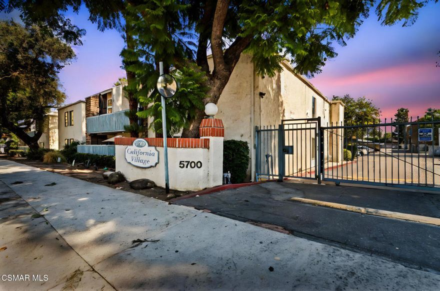 Welcome to this bright, light-filled top floor, 2 bedroom, 1 bath condominium in the sought-after California Village community! This stylish home features a spacious open floor plan featuring a kitchen that opens to a living room with vaulted ceilings and motorized curtains for the upper windows. The primary bedroom offers a walk-in closet and a private balcony provides serene tree-top views.Community amenities include a pool, jacuzzi, club house, gated entry with overnight security, and two side-by-side parking spaces. HOA dues cover water, trash, weekly complex cleaning, pool/jacuzzi maintenance, tree trimming, and overnight security. Recent building upgrades include a new roof installed in 2024. Conveniently located near Ventura Boulevard dining and shopping, Providence Cedars-Sinai Tarzana Medical Center, parks, and the 101 Freeway.