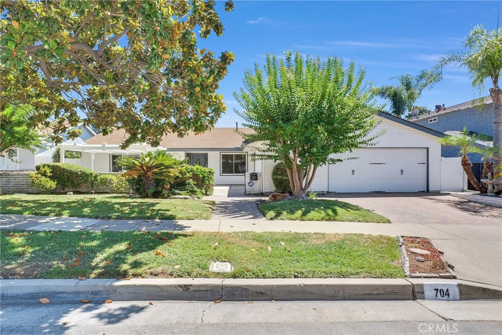 This fabulous, single story, pool Home on tree lined cul de sac has it all. Upgraded, move in ready, open, light and bright. A perfect blend of comfort and elegance, this home has so much to offer. Starting with the huge formal living room with extra large picture window and formal dining room, providing plenty of space to entertain in style. Remodeled kitchen with an abundance of shaker style wood cabinets with pull out shelves, granite counter tops provide all the counter space you could want, all new stainless appliances, recessed lighting and gorgeous garden window overlooking beautiful Lanai and pool. Family room off kitchen has inviting fireplace and slider to Lanai for indoor outdoor living. Family room has been expanded into (previous) bedroom #4 (easily add a wall and closet for 4th bedroom). Spacious primary suite with ample closet space, en suite bath and slider with pool view. The 2nd and 3rd bedrooms are very nice size. Hall bath remodeled with new tub/shower tile surround, vanity, quartz counter tops, fixtures, mirror and tile floors. Home has beautiful engineered hard wood floors, new carpet in primary and 2nd bedroom, freshly painted throughout, dual pane windows, new ceiling fans, new plugs and switches. Beautiful panel doors including closets, led recessed lighting, central heat and air, separate indoor laundry room and walk in pantry. Outside is a show stopper with fabulous covered lanai, overlooking gorgeous pool with water feature and Baja shelf. Backyard pavers add to the beauty and easy upkeep. Landscaping is outstanding and yard if very private. There is also a huge front patio, pavers on driveway and a 2.5 car garage (one side has a pull through - great for small boat, wave runners or ???) and lots of cabinets and work space. This is the perfect place to vacation at home of have huge gatherings. Wonderful location, friendly -"Leave it to Beaver" type neighborhood. Don't miss out on this one!