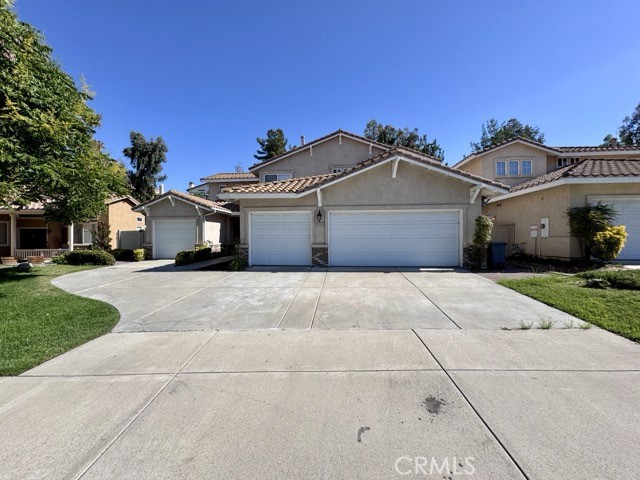 Rare opportunity to lease a home in the desirable Vintage Hills neighborhood featuring 4 garage spaces! This spacious residence offers 4 bedrooms, 3 full bathrooms, and two garages (a 3 car garage plus a separate 1 car garage). Updated in 2019, the home boasts new carpet, new flooring, fresh paint, and kitchen upgrades. Upon entry, you’ll find direct access to the 1 car garage, a formal dining room, and a welcoming family room. The family room opens seamlessly to the kitchen and living area, complete with a cozy fireplace and direct access to the backyard. Perfect for entertaining, the backyard features a covered patio, ample lawn space, and a hillside yard. The main level also includes a downstairs bedroom (no closet), a full bathroom, an oversized laundry room, and interior access to the 3-car garage. Upstairs, a versatile loft offers space for a home gym, office, or additional lounge area. The owner’s suite includes an en suite bathroom with a walk-in shower, soaking tub, and walk-in closet. Two additional bedrooms and another full bathroom complete the upper level. Vintage Hills community amenities include 2 pools, a spa, clubhouse, parks, tennis and basketball courts, playgrounds, and more. Conveniently located near Meadows Village Shopping Center, Temeku Hills Golf Club, and the Temecula Wine Country.