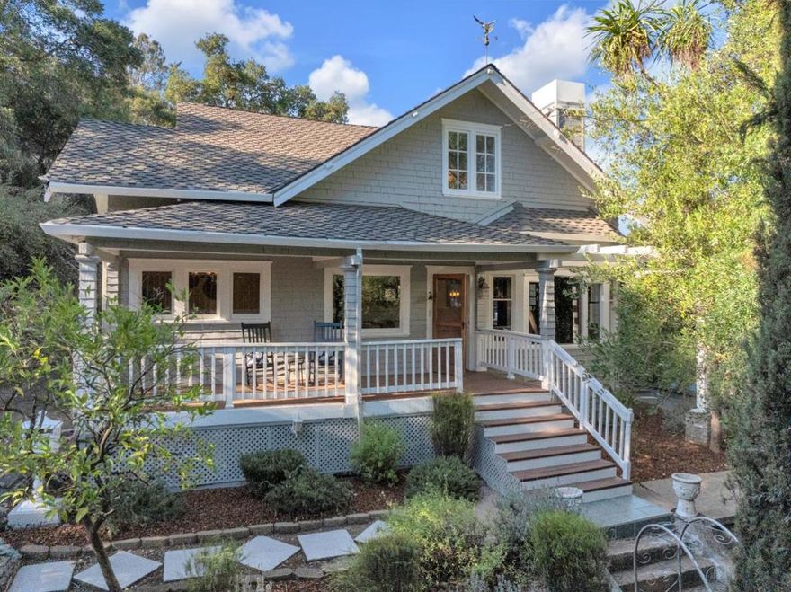 A timeless Craftsman masterpiece nestled on a sprawling over 1/2 acre lot with breathtaking views, just steps from vibrant downtown Morgan Hill. This exceptional home is the perfect blend of classic character, modern comfort, and a truly unbeatable location. The entertainers dream outdoor kitchen and elevated deck overlook rolling hills and sparkling city lights, creating a private resort experience complete with a two-tier black concrete bar, dual refrigerators, kegerator, range, undermount sink, and two Bromic Tungsten Smart Heaters for year-round enjoyment. An awe-inspiring front porch leads inside to rich hardwood floors, crown molding, and custom wainscoting that highlight the stunning living room and executive office framed by tapered columns and a wood beam. The formal dining room features an original pocket door, built-in buffet, and a beautiful chandelier. Two downstairs bedrooms include fully remodeled ensuite baths with designer tile and frameless glass showers. Upstairs, dual primary suites each offer their own distinctive character. One with an oversized farmhouse door, dual closets, fireplace, and modern shower with skylight views; the other with warm wood detail, soaking tub, and dual vanities. Timeless elegance meets modern living in this extraordinary estate.