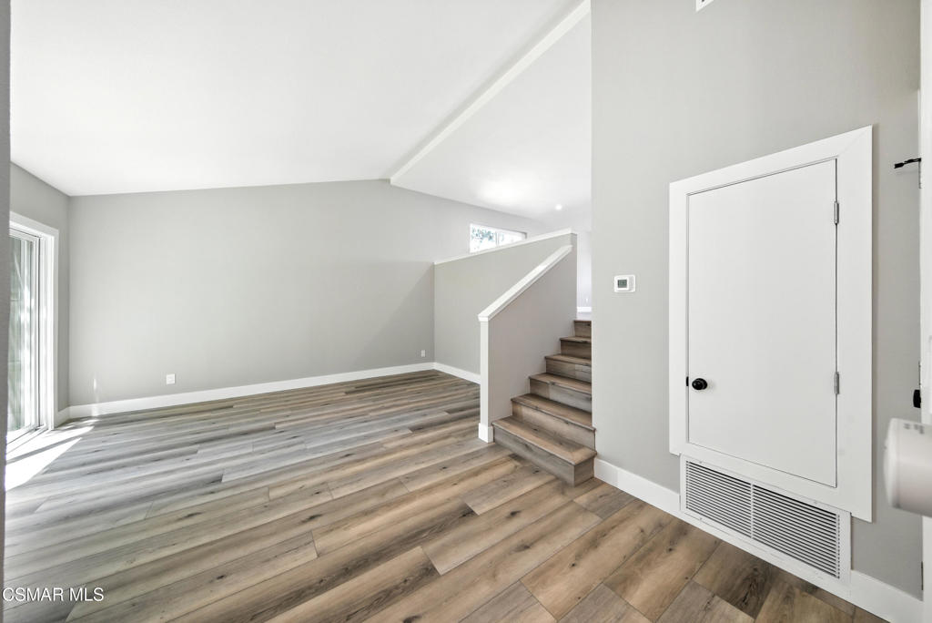 Fully remodeled townhome nestled in the heart of Canoga Park. Located in a gated community. This home boasts dual-paned windows, wood-like flooring, a cozy tile fireplace in the living room, and a newly installed HVAC system. The modern kitchen is equipped with quartz countertops, tile backsplash, and stainless steel appliances. The primary bedroom has a walk-in closet and an en-suite bathroom with quartz countertops and a tile shower/tub. The secondary bathroom also has an en-suite bathroom with quartz countertops and tile shower with a barn door style glass door. The backyard/patio area has been newly landscaped with turf. Attached 2 car garage with epoxy floor. The community offers amenities including a pool, spa, tennis court, walking areas through the greenbelt.