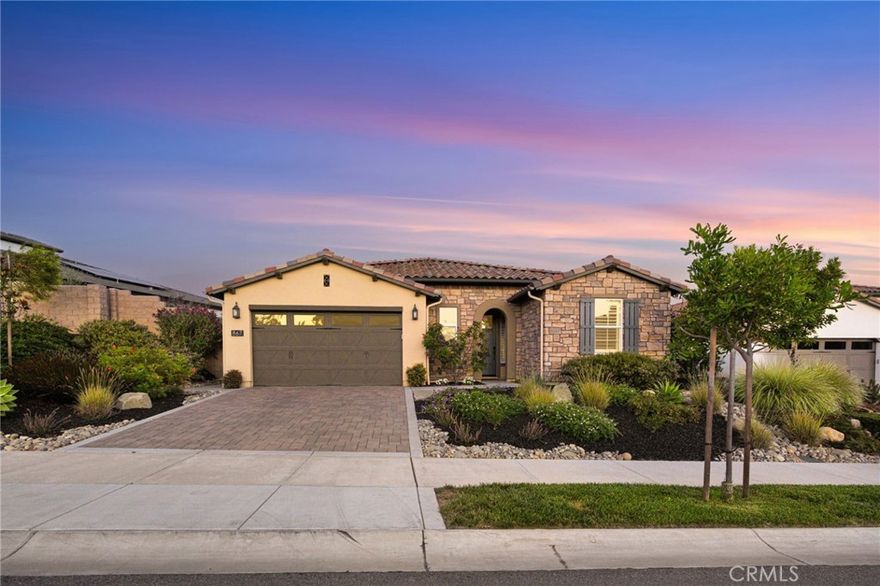 Your dream lifestyle begins at Trilogy at Monarch Dunes – a premier resort community along California’s Central Coast, where coastal breezes, vineyard views, and a welcoming sense of connection define daily life. Set on a peaceful, vineyard-view homesite, this vineyard vista home is an elegant Monterey model offering 1,924 square feet of refined single-level living. Built in 2021, this thoughtfully designed home captures the perfect balance of sophistication and comfort. The open-concept great room flows seamlessly to a chef’s kitchen featuring a matte-finish quartz island, walk-in pantry, and casual dining nook – ideal for gathering with friends or enjoying a quiet morning coffee. Sliding doors invite you outdoors to a spacious covered patio overlooking a beautifully landscaped backyard with a stone fire pit, soothing waterfall feature, and a raised garden bed – all framed by tranquil vineyard scenery.



The primary suite offers a serene retreat with dual vanities, a large walk-in closet, and spa-like finishes. A separate den and private office add flexibility for work, guests, or creative space. This home includes a fully paid solar system, smart-home features, and a two-car garage with epoxy flooring, built-in cabinetry, and extended side storage. As a Trilogy resident, you’ll enjoy an unparalleled resort lifestyle – championship golf, pickleball and tennis, a state-of-the-art fitness center, resort pool, full-service spa, and an inviting clubhouse restaurant where neighbors become friends. Here, every day feels like a retreat, and every evening ends with a coastal sunset worth savoring.