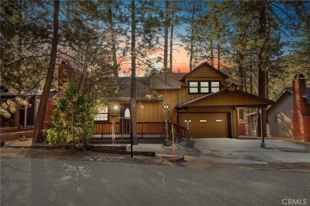 Welcome to 5744 Heath Creek Dr – a cozy mountain getaway full of Wrightwood charm! Located on a quiet, peaceful street, this 2-bedroom, 2-bathroom home offers classic cabin vibes with real wood paneling and beautiful beamed ceilings throughout.
Enjoy morning coffee on the inviting front porch with a porch swing or unwind on the freshly painted rear deck overlooking the serene backyard that backs up to the wash—no rear neighbors for added privacy. With a single-car garage, covered carport, a workshop with electric in the rear of the yard, and RV hookups - you’ll have all the space you need for mountain living.
The spacious backyard offers endless potential to create your own idyllic outdoor retreat—garden, entertain, or simply relax under the trees. This is your chance to own a charming slice of Wrightwood in a tranquil setting.
Buyers and/or their agents to verify all information including square footage, permits, and property boundaries.