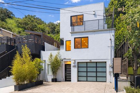 Photo of 1655 N Beverly Glen Blvd, Los Angeles, CA 90077 (MLS # PW26045030)