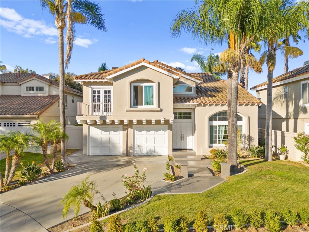 Welcome to 26562 Via Mondelo, a stunning 4-bedroom, 2.5-bathroom home located in a serene cul-de-sac, offering the perfect blend of modern elegance and cozy living in the highly desirable Mission Viejo community. Spanning 2,089 square feet, this beautifully remodeled residence is designed for both comfort and style. The inviting living area boasts a charming fireplace, perfect for cozy evenings, while large sliding doors lead to your private backyard oasis. Step outside to discover a beautifully landscaped space complete with a sparkling pool and spa, surrounded by greenery and no back neighbors, ensuring your privacy and tranquility for relaxation and outdoor gatherings with friends and family. The luxurious primary suite is a peaceful sanctuary, offering a spa-like en-suite bathroom complete with a soaking tub, and a separate shower. Each additional bedroom is spacious and versatile, perfect for family, guests, or a home office. Located in a vibrant neighborhood, this home is just minutes away from top-rated schools, shopping, dining, and beautiful parks. Enjoy easy access to scenic Lake Mission Viejo and the stunning beaches of Laguna and Dana Point, only a short drive away. This exceptional property combines luxury, convenience, and a welcoming atmosphere, making it the perfect place to call home. Don’t miss your opportunity to experience the best of Mission Viejo living!
