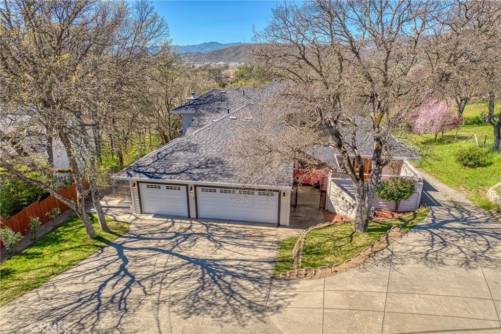 This stunning 5-bed, 4-bath, 4,241 sq. ft. home, including a 3-car garage, sits on 1.16 acres in the gated Hidden Valley Lake community, offering luxury, space, and investment potential. The beautifully renovated 2-bed, 1-bath basement features 9-ft ceilings, new flooring, ample storage, a private deck, and Bosch induction & convection appliances, custom cabinetry, and sleek countertops.
The main level is bathed in natural light with large windows, soaring 15-ft cathedral ceilings, and a cozy fireplace in the spacious family room. The chef’s kitchen boasts dual ovens, a built-in wine rack, and an open floor plan perfect for entertaining. The primary suite is a true retreat with new flooring, direct porch access to a serene fountain and garden area, a walk-in closet, and a renovated spa-like bathroom with a jetted tub, walk-in shower, and balcony access. A dedicated office with built-in bookshelves, a laundry room with new tile flooring and washer/dryer, and a balcony with breathtaking mountain views complete this level.
Upstairs, the mezzanine level offers two additional bedrooms and a renovated bathroom with new countertops and sink. Most furniture can be included, making this home move-in ready!
Outside, enjoy a graveled area for plenty of extra parking, a beautifully landscaped yard, and plenty of space for gardening. Additional features include a 2nd driveway and an EV charging station in the garage. Located just 30 minutes from Wine Country, this private retreat is within a gated community featuring a private lake, golf course, tennis courts, a country club, pool, and more! You don't want to miss out on this opportunity!