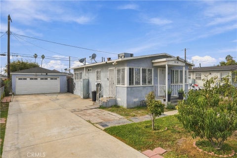 Photo of 916 E 103rd Place, Los Angeles, CA 90002 (MLS # SW26226173)