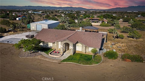 Photo of 8755 Kittering RD, Oak Hills, CA 92344 (MLS # CV26182151)