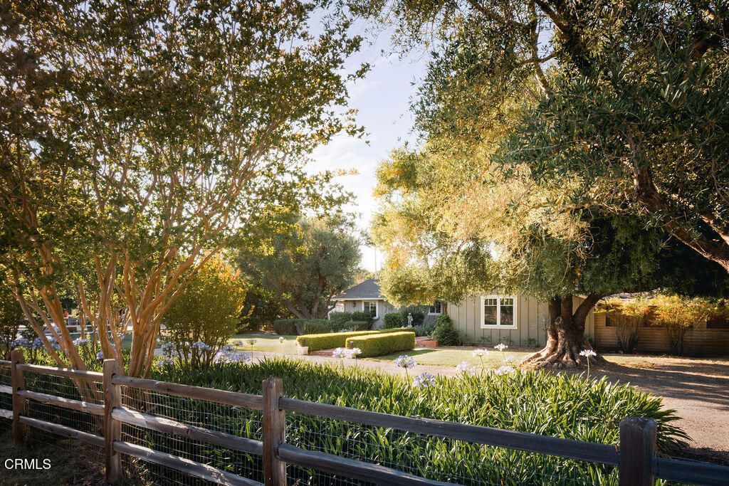 Enjoy this expansive 2,750+/- sq ft home featuring 3 bedrooms plus an office and 3 bathrooms, or easily close the adjoining doorway to separate it into a main house and a private guest suite.Set on just under an acre, with majestic olive trees, blooming roses and brick pathways, in the desirable Skyline Park neighborhood, this versatile property offers a rare blend of comfort, style, and functionality with multiple living spaces - ideal for multi-generational living, guest accommodations, or creative at-home work spaces.The beautifully remodeled main house, approx. 1,804+/- sq ft, features 2 bedrooms plus office, 2 bathrooms, and a garage conversion transformed into a spacious family room with bay windows and a cozy woodstove. The kitchen is a true centerpiece, showcasing an expansive island with sink and seating for three, complemented by a rustic brick backsplash and quality finishes throughout. The inviting living room features wood-beamed ceilings, a large stone fireplace, and glass French doors that open to the backyard retreat complete with a private pool and spa-perfect for entertaining or unwinding under the stars.A gorgeous addition, completed in 2016 at approx. 900+/- sq. ft., offers a 1 bedroom, 1 bathroom guest suite with a private entrance, open kitchenette and living area with fireplace, walk-in closet, laundry, and a fenced yard.Follow the ranch-style drive tucked away to the side, back to the barn structure that includes garage parking for 3 cars an office, and a 1 bedroom, 1 bathroom cabana upstairs spanning approx. 798+/- sq ft. Outdoors, you'll also find a corral and turnout-great for a horse or 4-H animals, room to garden and parking for all of your recreational vehicles.Located just minutes from Santa Ynez Valley High School, the YMCA and downtown Santa Ynez, this peaceful property benefits from non-metered water at a flat quarterly rate (449) and all the charm of the Skyline Park community.