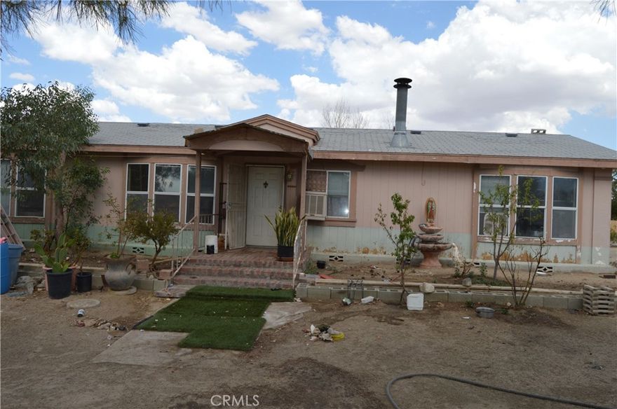 You couldn't make a better deal today! 2.4 acres with 2 manufacture homes, main manufacture home 3 bed 2 bath, it will be great for a fixer upper, below market with a lot of potential. Amazing trees, plenty of room for your toys, RV, Semi Tracks. Discover wide-open space and breathtaking scenery in this private high-desert escape. Seller willing to finance it.