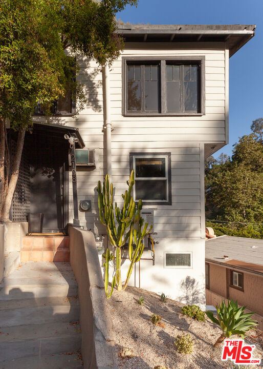 Welcome to 2108 Tavern Trail, located in the heart of Laurel Canyon. This spacious 2-bedroom, 2-bathroom lower unit features a unique split-level design and has been thoughtfully updated throughout. A detached bonus structure provides additional flexibility and can be used as a home office, gym, or creative studio. The residence offers a private outdoor area surrounded by mature landscaping, creating a tranquil setting with seamless access to nature and city life. Additional features include a dedicated laundry area and a highly desirable location just steps from the Canyon Country Store and Pace restaurant. Situated within the Wonderland School District, this home presents a rare leasing opportunity in one of Los Angeles' most sought-after neighborhoods.