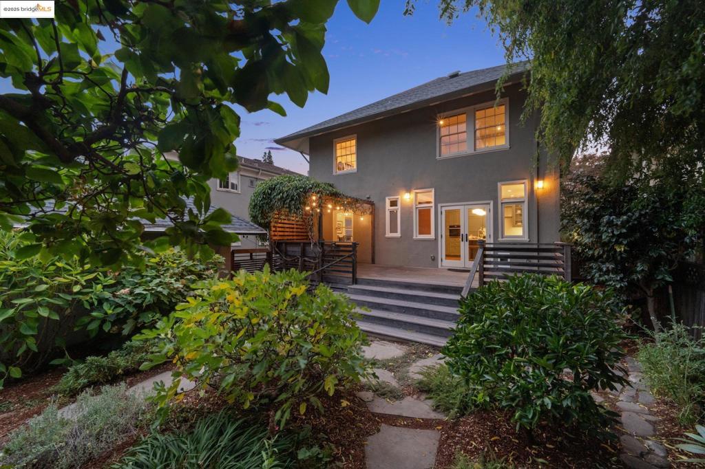 Magnificent 1915 neoclassical building filled with period details. Spanning 2868 sq ft, this architectural gem exudes timeless charm with its original hardwood floors, elegant wainscoting, intricate crown molding, and stately fireplaces that anchor the home’s historic allure. The ground floor welcomes you with two spacious bedrooms and a beautifully remodeled bathroom, complemented by a show-stopping $300,000 kitchen renovation that blends modern sophistication with classic style. Outside, a spectacular botanical garden creates a serene oasis, while a detached 150 sq ft studio offers the perfect retreat for a home office, yoga space, or creative haven. Upstairs, the second floor mirrors the home’s grandeur with two additional bedrooms, a large dining room ideal for gatherings, a remodeled bathroom, and another exquisitely updated kitchen. A finished attic, complete with its own bathroom, provides versatile bonus space for a private retreat, guest suite, or hobby area. Both levels feature in-unit laundry and an abundance of storage, ensuring practicality matches the home’s beauty. A long driveway and garage provide ample parking, adding to the convenience of this exceptional property.
