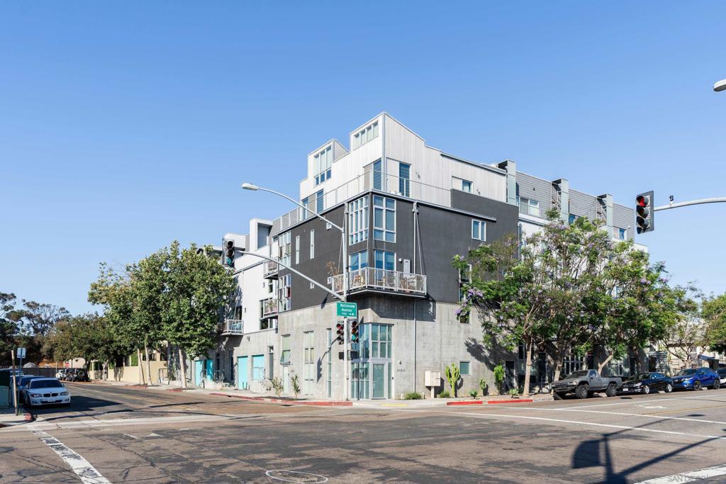 VA APPROVED! Located just 2 blocks from Downtown San Diego, this two bedroom (with optional 3rd) live-work townhouse is unlike anything on the market. Enter the gated complex from your own private two-car stacked garage (with power lift) and head to your industrial two-story loft townhouse that shares no walls or floors with anyone else in the complex, giving you unprecedented privacy in the city. Inside you're greeted by incredible modern design and abundant natural light. The large and well-appointed kitchen is the perfect space to entertain before heading out for dinner and drinks. The downstairs bedroom has dual walk-in closets and its own en-suite bathroom, finished in seductive black and white tiles. Adjacent to the kitchen you'll find a half bath perfect for guests while entertaining. Enjoy views of the Coronado Bridge from multiple rooms and the upstairs balcony. The primary bedroom along with its walk-in closet and bathroom are enormous. Keep the upstairs loft as another living space or use it as a third bedroom; the choice is yours. Laundry in-unit! Walking distance to many restaurants, breweries, Petco Park, San Diego Harbor, the Rady Shell, and downtown San Diego. Barrio Logan has quickly become one of the trendiest, most vibrant neighborhoods in all of San Diego with its rich history, colorful murals, fantastic food, and abundant entertainment. Invest here before it's too late! This truly is an excellent property and must be seen to be appreciated. Some photos virtually staged.