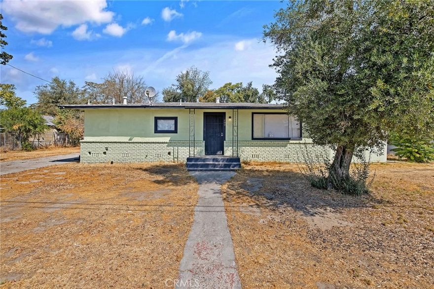 Great investment opportunity or ideal starter home! This updated 3-bedroom, 1-bathroom residence sits on a spacious corner lot just shy of a quarter acre and is conveniently located near Lincoln Elementary School. The home has been tastefully renovated with fresh interior and exterior paint, new kitchen cabinets with butcher block countertops, refinished hardwood floors, updated bathroom vanity and cabinet, and vinyl flooring in all wet areas. Nearly all windows have been replaced, enhancing comfort and efficiency. Zoned RM3, the property offers extra storage, ample space, and endless possibilities for rental income or expansion. Perfect for storing recreational items and hosting family gatherings.