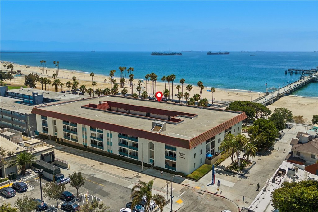Live the beach lifestyle in Belmont Shore! This one-bedroom, one-bath condo boasts an unbeatable location just steps from the sand and Belmont Veterans Memorial Pier, with dining, shopping, and entertainment all within walking distance. Enjoy ocean views from your private balcony, plus a view of the iconic Belmont Brewing Company from the walk street side of the building. While the unit could use some TLC, its prime location and potential make this an incredible opportunity. Low HOA dues include water, trash, building maintenance, and insurance. In-unit laundry and air conditioning installation are allowed. Ideal for those who love walking or biking, this home includes a dedicated parking space in the gated, ground-level enclosed parking garage, plus a storage room for your bike. Perfect for beach lovers!