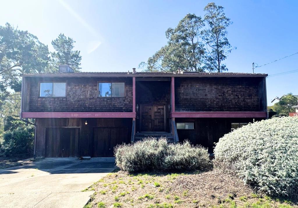 Welcome to this inviting split-level home in the desirable El Granada Highlands. Set on a 5,581± sqft lot, this 1,890± sqft residence offers 3 bedrooms and 2.5 bathrooms with a comfortable and versatile layout. The main level features a spacious living and dining area with abundant natural light, creating an ideal setting for both everyday living and entertaining. The living room boasts high ceilings with open beams and a wood-burning fireplace. A well-appointed kitchen opens to a casual dining space. Upstairs, find the primary suite that opens to the spacious upstairs deck with its own ensuite bath, walk-in closet, and a convenient half bath. The lower level is finished with 2 bedrooms and a full bath and provides a flexible space, perfect for a home office or media space. Outdoor spaces include a deck and yard areas to enjoy the coastal setting. Conveniently located near local beaches, Pillar Point Harbor, hiking trails, and restaurants, with an easy commute to San Francisco or Silicon Valley.