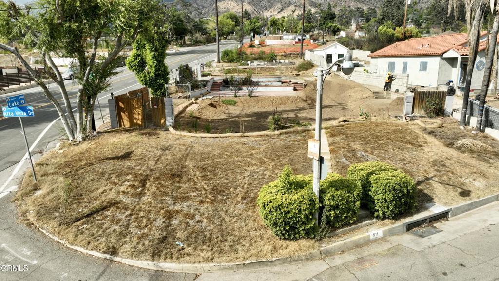 Discover an exceptional opportunity in Altadena to create two distinct dwellings on a single lot, complete with separate gas and water meters. Perfectly positioned at the corner of Alta Vista Drive and Lake Avenue, this parcel spans just over 10,000 square feet, providing generous space for the construction of two private residences. Formerly the site of 911 Alta Vista Drive and 2930 Lake Avenue, this property invites you to envision and build your ideal living spaces in a prime location. Ideal for owner-users seeking to have family members like parents or in-laws close by, or for those interested in utilizing the second dwelling as a rental property. Take advantage of being near Lake Avenue's array of local shops and dining options, as well as community parks like Farnsworth Park, which offers pickleball, basketball, and a playground for children.
