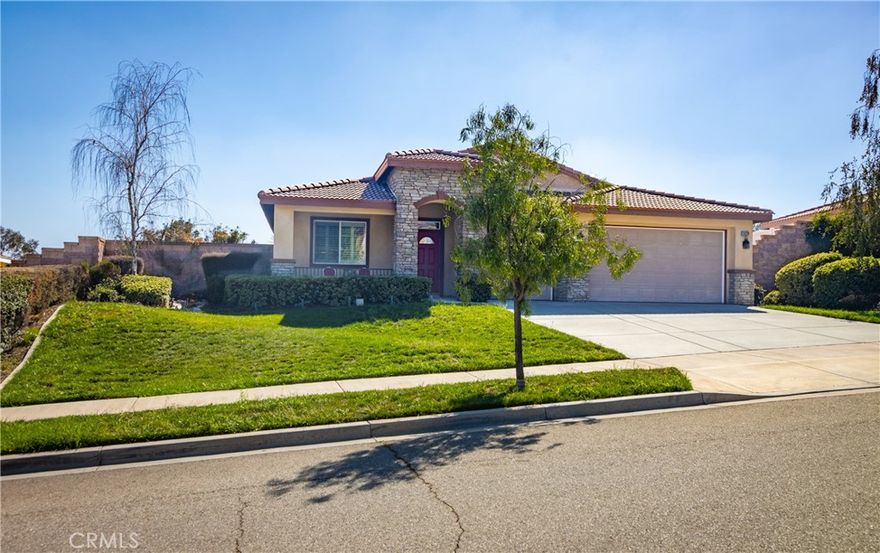 Welcome to The Reserve at Crafton Hills! This beautiful Single-Story Home offers the perfect blend of comfort, space, and style. Featuring 4 spacious bedrooms and 2 bathrooms with dual sinks, this open-concept floor plan is designed for modern living. The kitchen boasts granite countertops, stainless steel appliances, a center island with bar seating, and plenty of cabinet space, flowing seamlessly into the large family room with a cozy fireplace. You’ll also enjoy a formal dining area, separate laundry room, and generous living room ideal for entertaining or relaxing.  Step outside to a large backyard with a covered patio and elevated deck, perfect for outdoor dining and enjoying the beautiful mountain views. The low-maintenance landscaping makes upkeep a breeze. Additional features include a 3-car garage with built-in storage.  Located in the desirable Reserve at Crafton Hills community, this home combines comfort, convenience, and charm—ready for you to make it your own!