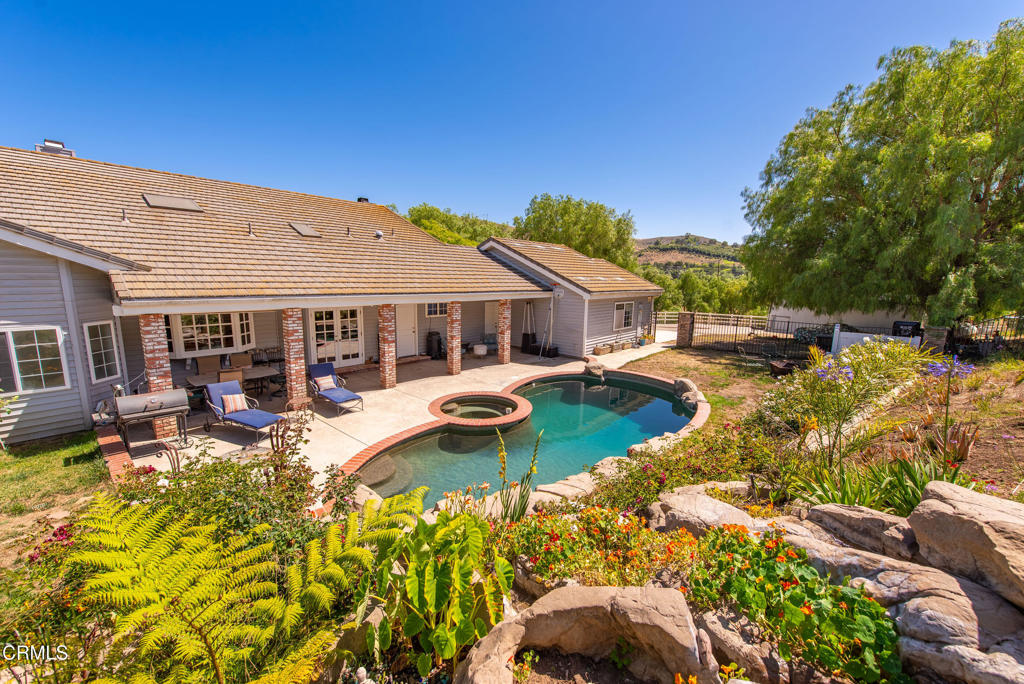 Stunning Santa Rosa Valley Ranch! Welcome To This Beautiful Single-Story View Home With 4 Bedrooms, 3 Bathrooms, 2808 SF Of Living Space Nestled On 5 Usable Acres With Gated Entry For Added Privacy. Charming Flagstone Path Winds Through Garden To The Front Door & A Spacious Covered Patio With Stunning Scenic Views. Enjoy A Chef's Kitchen With Granite Countertops, Stainless Steel Appliances, Electric Cooktop, Breakfast Bar, Skylight, Bay Window, Double Dishwasher With 2 Drawers, Built-In Bar With Wine Refrigerator & Pantry. Wood Laminate Floors Throughout Main Living Areas. Large Room Off Kitchen With Brick Fireplace, High Ceilings, Open Wood Beams & French Doors That Lead To The Front Covered Patio. Bright & Open Living Room With Marble Fireplace. Formal Dining Room With Tile Floor & Ceiling Fan. Guest Bedrooms Feature Mirrored Closet Doors & Ceiling Fan. Full Bathroom Includes Dual Sinks, Tile Countertops & Shower/Tub Combo. Additional Room May Serve As An Office Or Bedroom With Built-In Cabinets & Ceiling Fan. The Spacious Primary Suite Offers Vaulted Ceilings, French Doors To The Backyard, Dual Sinks, Jetted Tub, Walk-In Shower, Recessed Lighting & Walk-In Closet With Organizers. Separate Laundry Room With Cabinets, Sink, Washer/Dryer & Adjacent Full Bathroom With Walk-in Shower. Additional Features Include Plantation Shutters Throughout, Dual Paned Windows, A/C, Skylights, Concrete Tile Roof, Storage Shed & Walk-In Attic With Full-Size Storage. Experience True Ranch Living With A Pebble Tech Pool & Spa Framed By A Cascading Waterfall, A Covered Patio, Mature Landscape & Wrought Iron Fencing. Enjoy Harvesting From Your Own Orchard With Orange, Lemon & Over 400 Avocado Trees. Plenty Of Room To Park RVs, Horse Trailers, Toys & More. The 3-Car Garage Includes A Dog Wash, Sink & Ample Storage. Ideal For Animal Lovers & Equestrians--Featuring A 2-Stall Barn With Tack Room, Chicken Coop, White Perimeter Fencing & Zoning For Multiple Horses. Enjoy Easy Access To Scenic Riding Trails & A Nearby Public Horse Arena In The Heart Of Santa Rosa Valley. Private, Peaceful & Ideally Located - Enjoy Country Living With This Rare Opportunity To Own A Private Retreat Just Minutes From Thousand Oaks, Moorpark, Camarillo & Easy Freeway Access.