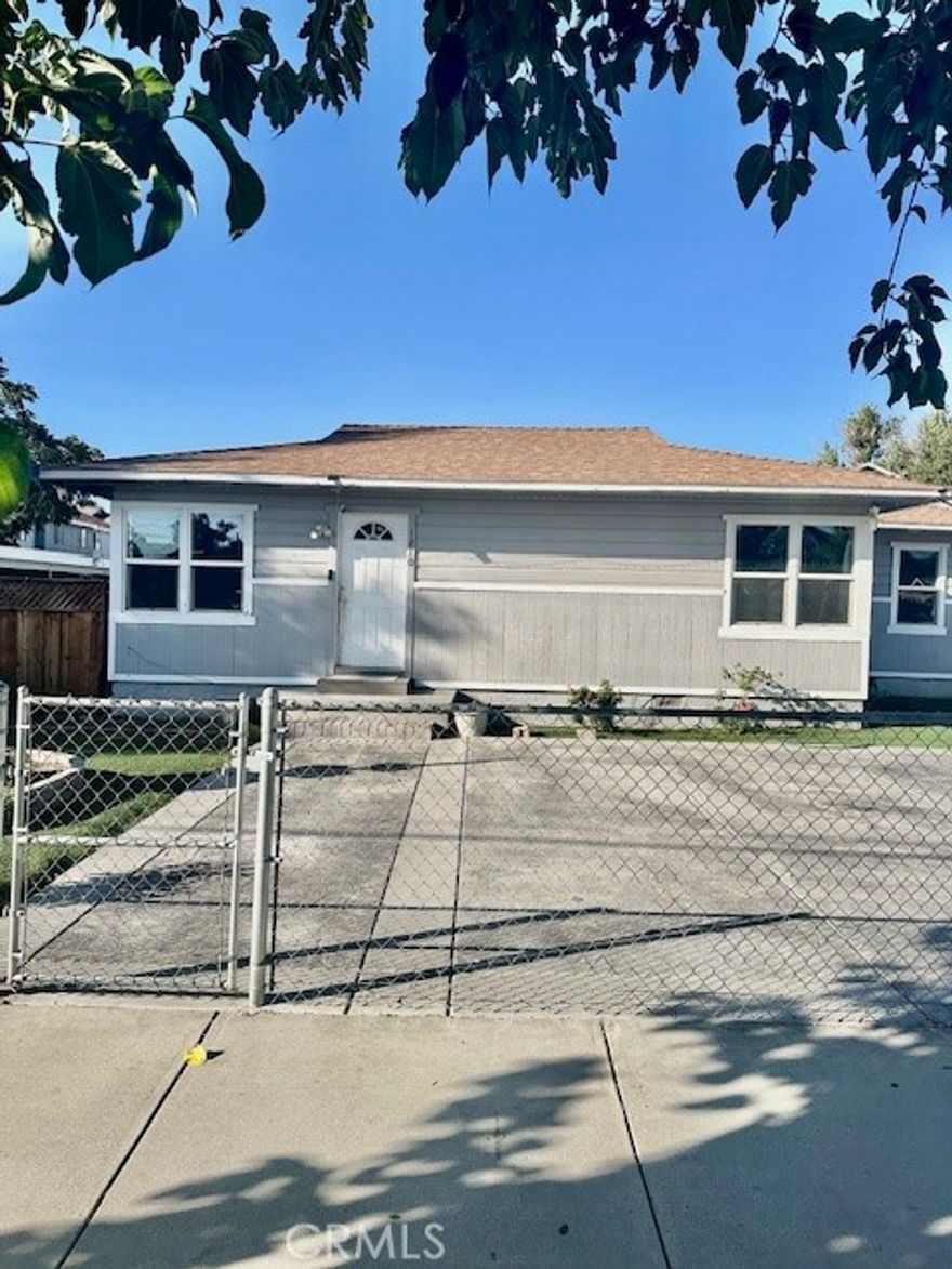 A Charming 2 bedroom, 1 bath offering 1,094sq ft of living space on a enormous 15,246 Sqft lot. This property provides incredible potential for anyone looking for a specious yard perfect for RV parking, adding an ADU, or creating your dream outdoor retreat. Inside you'll find a functional layout with plenty of natural light, a comfortable living area, and a cozy kitchen ready for your personal touch. The expansive backyard offers endless possibilities for expansion or entertaining. This home is located close to schools, shopping, and major roads.