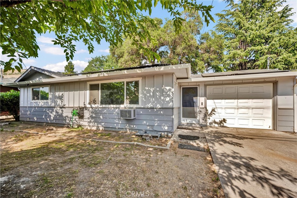This property features three bedrooms, two bathrooms, a den, and a detached bonus room estimating about 390 sq. feet. The backyard is fenced and includes a covered patio with a hot tub that is perfect for outdoor engagements. Additionally, the house has solar panels and is conveniently situated within walking distance of the lake.
