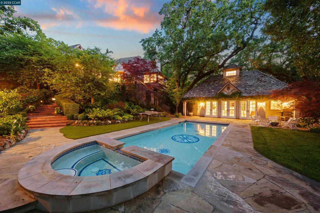 Welcome to this stunning, private, & incredible one of a kind Classic Orinda Country Club home! Magically set in an heirloom garden w/meticulously maintained Black & Valley Oaks & flowers blooming almost yr. round. Originally built in 1933 & designed by prolific architecture firm, Miller & Warnecke, &beautifully updated over the ys, this story book home oozes with undeniable charm inside & out including a Slate roof, original brick upper patio w/cafe lights lovely for entertaining, a vintage tiled pool & hot tub, multiple spots for entertaining indoors & out & lovely garden views out every window. Enter into the grand foyer to the spacious living room w/high beamed ceilings, an oversized wood burning fireplace & multiple sets of doors to the outdoor patio also adjoined to the dining room & recently remodeled (2022) eat-in, state of the art designer kitchen which opens to the informal dining area & family room. The fabulous & newly renovated primary wing boasts a gym, office, & perfectly appointed custom bath. 3 more beds & 2.5 baths in the main house & 1 bed, 1 bath upgraded pool house to host overnight guests or parties. Pool, built in fire pit, putting green, wine cellar, tons of storage, unique designer light fixtures & more! Visit https://www.33-lanoria.com for all the deets!