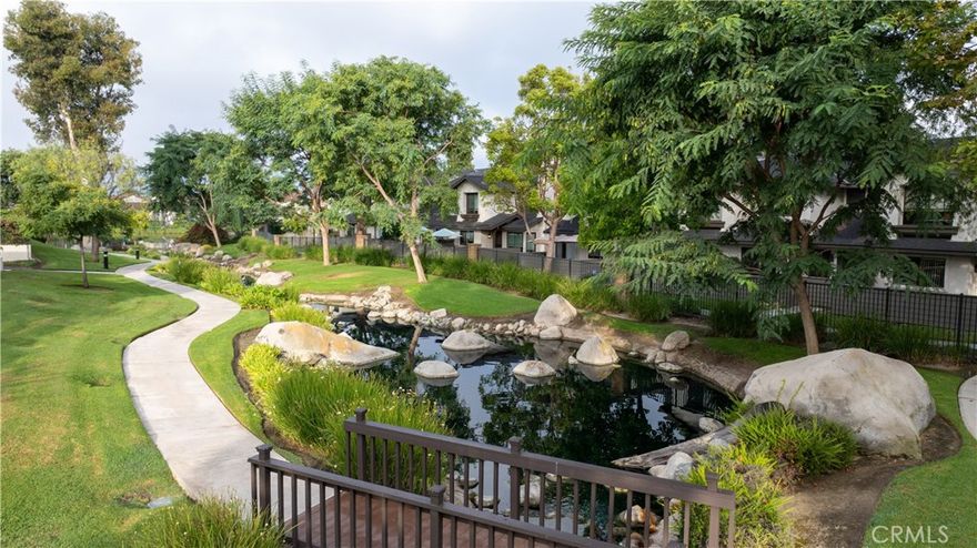 Charming Two-Level home offering 2-Bedrooms, 1.5 bathrooms with direct garage access. This beautifully maintained Lakeview Townhouse unit is nestled near the serene and sought-after Anaheim Shores neighborhood. Serene views unfold before you, with a gentle stream winding through the landscape and mature trees providing a lush green canopy. Enjoy your morning coffee on your lush private patio or unwind at the end of your day enjoying the premium views. The open layout is perfect for first-time buyers, down-sizers or investors looking for a move-in-ready property. Step inside to discover a well appointed kitchen equipped with a stove, microwave, dishwasher and plenty of counter space with bar top seating. Washer and dryer hooks-ups are conveniently located in the attached 2 car garage. The downstairs powder room and under-stairway storage is appreciated. Enjoy the natural light pouring into your open living room and separate dining area. Retreat to the comfortably sized bedrooms with ample and full mirrored wardrobes. Centrally located in a desirable neighborhood, this home offers easy access to schools, parks, shopping and dining options. Whether you're looking to live in or invest, this condo offers comfort, value, and location all in one. Don't miss this opportunity. Your dream home awaits!