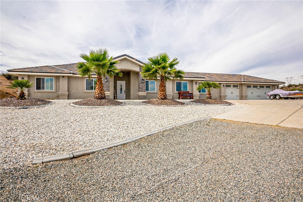 HUGE PRICE IMPROVEMENT!! Get ready to fall in love with 10375 Buffalo Rd. in Oak Hills—this one checks every box! Built in 2019 and sitting on just under 2.5 acres, this stunning 4-bedroom, 3-bath single-story home offers 2,303 sq. ft. of pure perfection. The open layout is ideal for modern living, with a show-stopping kitchen, oversized bedrooms, and a cozy fireplace that makes you want to kick back and stay awhile. Bonus? One of the bedrooms has its own private bath—hello, dual primary suites! The attached 3-car garage is spotless, featuring gorgeous epoxy floors and plenty of space for your cars, toys, or tools. The land? Wide open and full of potential—RV parking, horses, a workshop, maybe even that dream pool. Turnkey, move-in ready, and packed with possibilities… this is the one you’ve been waiting for!