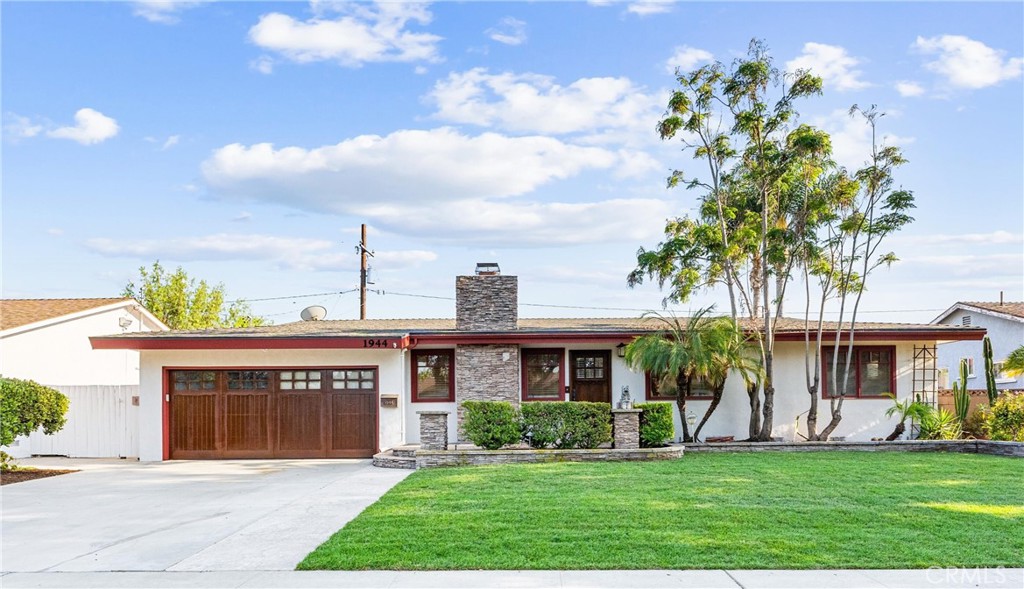 Beautiful Single-Story Pool Home in Desirable Anaheim Neighborhood. This stunning single-story home offers 2,008 sq. ft. of stylish, comfortable living in one of Anaheim’s most sought-after neighborhoods. With incredible curb appeal and a thoughtful layout, this property is perfect for everyday living and entertaining. The heart of the home is the spectacular modern kitchen, complete with custom craftsman-style cabinetry, granite countertops, a pull-up breakfast bar, and stainless steel appliances, including a high-end Thermador stove and built-in refrigerator/freezer. The kitchen flows seamlessly to a dining area with a cozy fireplace, recessed lighting, and backyard views. It also opens to a spacious family room that could easily be converted to a fourth bedroom if desired. This home features 3 bedrooms and 2.5 bathrooms, including a private primary suite with an en-suite bath. The additional bedrooms are generously sized and share a well-appointed hall bath, while a convenient powder room is perfect for guests. The backyard is your personal retreat, complete with a sparkling fenced pool, a covered patio with a ceiling fan, and a custom-built BBQ area, ideal for enjoying sunny California days. Additional features that enhance comfort and convenience include a tankless water heater, a central attic fan, and a two-car garage with direct home access. The home also boasts incredible curb appeal with new exterior paint, a freshly stained garage door, new front yard sod, and exterior stacked stone accents. Conveniently located near schools, parks, shopping, dining, and entertainment, this home offers the perfect balance of comfort, style, and location.