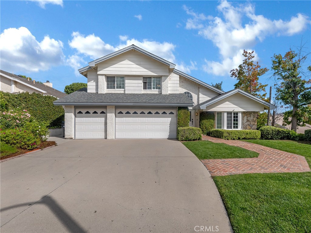 Located in the heart of Agoura Hills.  This is a Spacious 4 bedroom 3 bath home. Versatile downstairs bedroom can be used to fit so many needs. Attached 3 car garage provides so much storage. Grassy Backyard features a sitting area overlooking stunning Mountain views. Freshly painted walls with vaulted ceilings. Quick walk to Reyes Adobe Park, close to the 101 Freeway, and situated in Las Virgenes School District makes it a great place to make your home