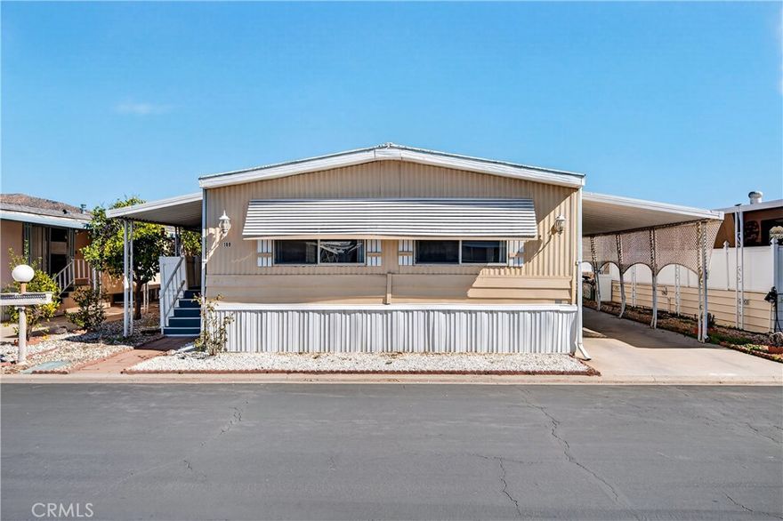 Welcome to 23820 Ironwood Ave Space #189, located in IL Sorrento Community Park—Moreno Valley’s premier 55+ gated community offering resort-style living in a peaceful, well-maintained neighborhood. This 2-bedroom, 2-bath manufactured home features approximately 1,440 sq. ft. of comfortable living space with a spacious kitchen offering ample cabinet and countertop storage, a cozy living room, separate family room, dining area, and convenient laundry room with extra storage. Steps lead to the front entry and a covered carport. Residents enjoy access to a clubhouse, swimming pool, BBQ island, and RV parking area. Conveniently located about 1 mile from shopping and Highway 60 access, and 2 miles from local parks. The property is on leased land with a monthly space rent of $900.