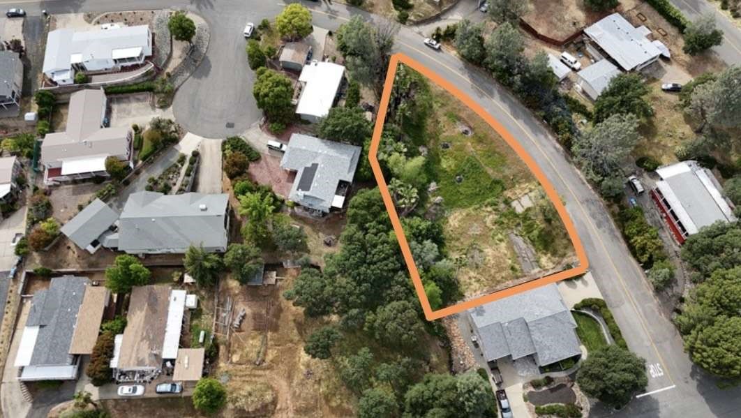 This 10,019 sq ft buildable lot offers the opportunity for striking curb appeal, with gentle sloping from the street, boasts an idyllic setting and a seasoned creek back of the lot ! If a 2-story house will be built, view of Lake Oroville. Utilities are available at the street, but none of the connections fees are paid. Buyer to verify those costs, Kelly Ridge Community offers direct access to boating, camping, fishing, hiking, golfing, horse trails, bike trails and an array of water sports. This Charming community is a popular place to live and enjoy the outdoors, ready for someone with vision to shape something truly special! ** Zoning MDR allow for mixture of housing type including ADU. Buyer to verify.