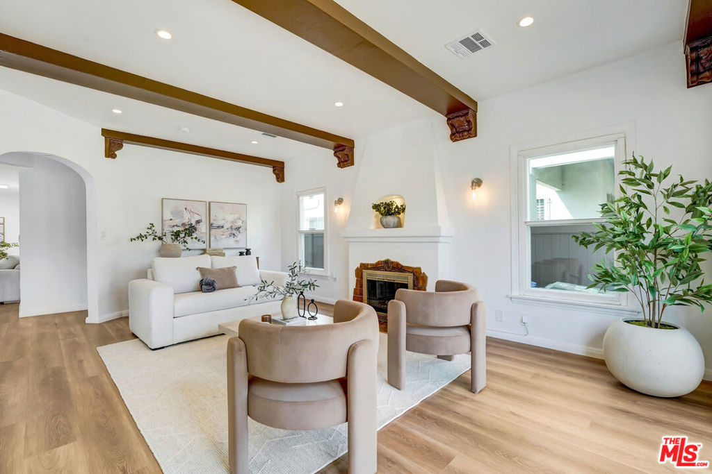 Sitting proudly on a corner lot, this Spanish beauty has been thoughtfully reimagined and restored with timeless charm and today's comforts. From its signature arches to its open, light-filled spaces, every detail reflects craftsmanship and style.Inside, you'll find all-new upgrades completed with permits: brand-new HVAC, plumbing, electrical, tankless water heater, and luxury vinyl plank flooring. Skylights fill the home with natural light, creating warmth and ambiance throughout. The kitchen is a showstopper with high-quality quartz countertops, sleek finishes, and an effortless flow that's perfect for entertaining.Outside, enjoy fresh landscaping with a brand-new irrigation system and new exterior gates enclosing the property, offering both beauty and privacy.Offering 3 spacious bedrooms and 2 full baths, plus a detached 2-car garage, this home is designed for both beauty and functionality. With ADU permits already secured for future expansion, every system updated, and every finish carefully selected, it's truly move-in ready giving you peace of mind for years to come.