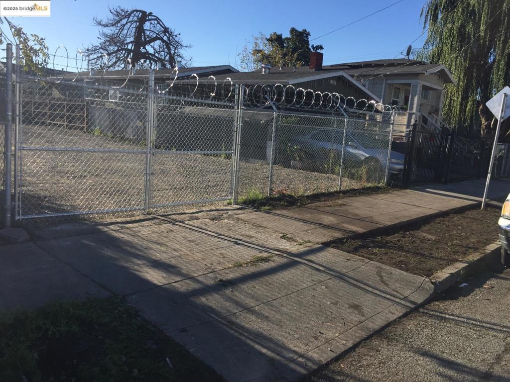 A rare opportunity to own a piece of East Oakland History - this cherished lot has been in the same family for over 60 years. This vacant lot is fully cleared, gated and secure and ready for its next chapter. Ready to build with Architectural drawings included for a modern duplex and ADU offering excellent potential for multi-generational living or income producing rentals. Located near key transportation hubs including BART and Oakland Airport. This flat, level lot is situated in a vibrant residential neighborhood with strong community roots. don't miss your chance to build new in a neighborhood with history, heart and convenience.