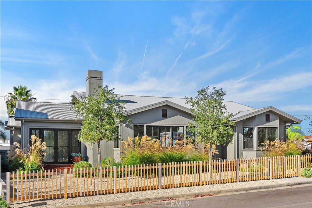Presenting a magnificent newly-built, single-story modern farmhouse in the sought-after Newport Heights neighborhood. Experience a harmonious blend of comfort and luxury, with only a short stroll to the water’s edge in Newport Harbor. Situated on a Rare 6,200 SF Corner Lot, with 4 spacious bedrooms, the open floor plan with high ceilings welcomes a flood of natural light, highlighting the beautiful custom finishes of this amazing coastal retreat. The appeal of this contemporary home begins immediately as you approach – with the charm of a low-gated pathway leading you through Sonoma-style custom landscaping to the entry door. The seamlessly connected great room, kitchen and dining area framed with large windows and pocket doors to the backyard, create the perfect opportunity for entertaining. The open-concept kitchen is the heart of the home, centered with an island with a seating ledge, gorgeous counter tops, Zellige tile backsplash, impressive floor-to-ceiling custom cabinetry with designer hardware, and completed with high-end appliances. The Primary Suite provides ample space and an elegant spa-like bath with floating dual-sink cabinets, floor-to-ceiling tiled shower with dual shower heads enclosed by glass. The thoughtfully-designed floor plan features stunning upgrades and craftsmanship by local design-build firm Clayton Builders throughout including wide-plank European Oak flooring, custom base-boards, recessed lighting, sound system, designer tiling, and more. Your guests will enjoy countless memories in your custom-designed backyard with a built-in BBQ and refrigerator, deck, and central firepit for many gatherings in So Cal’s ideal year-round climate. Experience the wide-variety of outdoor and water activities, including sailing, boating, paddle-boarding, and swimming and surfing with the Newport Harbor and the Balboa Peninsula just a few blocks away. You will enjoy convenient access to waterfront cafes, upscale boutique stores, fine dining, art galleries, and Lido Village, as well as nearby Newport Beach proper, Fashion Island, award-winning schools, Hoag Hospital, and the very finest for your Newport Beach lifestyle