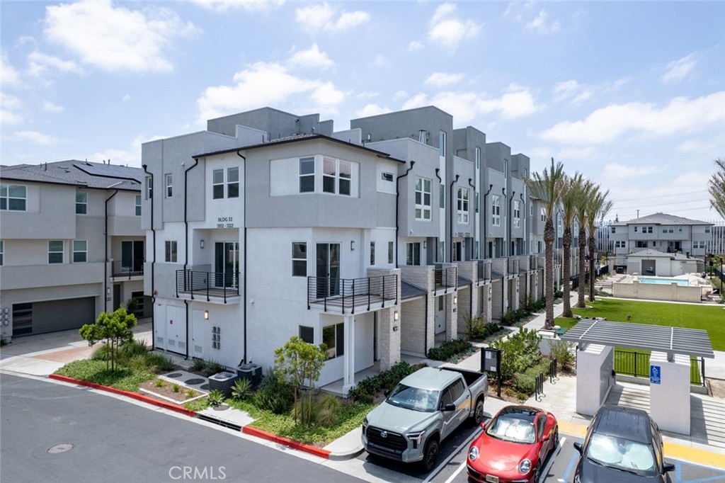 Welcome to 1302 W Bushell St, a townhouse located in the highly sought-after 100 West gated community by Toll Brothers. Built in 2023, this home blends comfort, style, and thoughtful design. Situated in the heart of Anaheim, the first floor features a bedroom and a bathroom, with three additional bedrooms on the third floor. Just steps from the community clubhouse, this home boasts elegant hardwood flooring, a spacious rooftop balcony, and an ideal layout for family leisure and entertainment. With direct access from the garage and proximity to the 5, 22, and 57 freeways, this beautiful home offers both ease and enchantment in one perfect package. Centrally located in Orange County, it offers easy access to Disneyland, Angels Stadium, Honda Center, and nearby shopping and dining. A perfect blend of Anaheim's vibrant lifestyle and comfortable living, this is a must-see dream home!