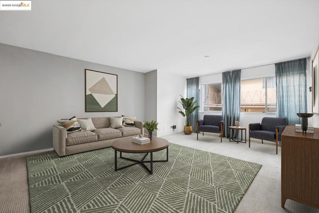 Just blocks from Lake Merritt, this light-filled two-bedroom condo checks all the boxes: open concept living, smart layout, and generous storage throughout. The kitchen, dining, and living areas flow seamlessly, creating a welcoming space to relax or entertain. Both bedrooms include full-size closets, and a hallway-length closet offers extra room for coats, gear, or seasonal storage. The kitchen features ample cabinet space, and a private storage cabinet in the garage adds even more flexibility. One dedicated parking space is also included. The building’s central atrium offers a peaceful communal space. Located near Grand Avenue shops, local cafés, and the farmers market, this home offers the best of Lake Merritt living with comfort and community in mind. Some photos have been virtually staged to help illustrate the home’s potential.