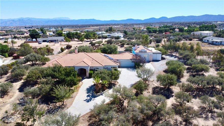 Welcome to this exceptional Oak Hills estate offering the perfect blend of comfort, privacy, and functionality. This stunning 4-bedroom, 4-bathroom home sits proudly in the center of its expansive 104,108 square feet lot, reached by a long private driveway that ensures peace and seclusion.

Step inside to find a spacious, open-concept layout with abundant natural light and a spacious inclosed sun room. The home’s resort-style backyard features a beautiful private pool, complete with a solar heating system for year-round enjoyment.

The property is equipped with a powerful solar energy system that produced approximately 42.8 megawatt-hours (42,800 kWh) in 2024 — a tremendous energy advantage for sustainability and cost savings.

Car enthusiasts and adventurers will love the large attached two-car garage, a massive RV garage, plus an additional covered RV parking area — offering space for all your vehicles and recreational needs.

The grounds include numerous fruit trees, open areas for gardening or expansion, and endless potential to personalize and enhance the outdoor space.

Located in the highly desirable West Oak Hills neighborhood, this home combines the best of modern efficiency, rural tranquility, and everyday luxury — an ideal retreat for those seeking space, privacy, and energy independence.