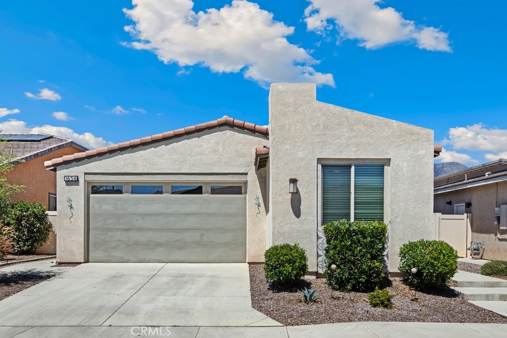 Priced to Sell – Motivated Seller!
Welcome to your modern oasis in the highly sought-after Altis 55+ active community. Built in 2021, this beautifully upgraded 2-bedroom, 2-bath home blends contemporary style, smart technology, and energy efficiency for truly effortless living. From the moment you step inside, soaring ceilings and abundant natural light create an open, inviting atmosphere. The gourmet kitchen, complete with modern appliances and generous counter space, flows seamlessly into the dining and living areas, making it perfect for both daily living and entertaining.
The primary suite offers a peaceful retreat with a spa-inspired bath, while the guest bedroom features its own en-suite for comfort and privacy. Throughout the home, luxury vinyl flooring adds warmth and durability, while Alexa-enabled smart features and leased solar provide convenience and long-term savings. A private patio extends the living space outdoors, ideal for year-round gatherings, while the garage offers golf cart parking and plenty of storage.
Life in Altis goes far beyond the home itself. Residents enjoy resort-style amenities, including a state-of-the-art fitness center, sparkling pool, pickleball courts, and a lively clubhouse that hosts social events, themed parties, and game nights. Scenic walking trails and engaging lifestyle programs make it easy to stay active and connected in this vibrant community where neighbors quickly become friends.
VA and FHA approved, this low-maintenance property is a rare opportunity to own a highly upgraded home at exceptional value. This home is located in the highly sought-after Gated Altis Community.