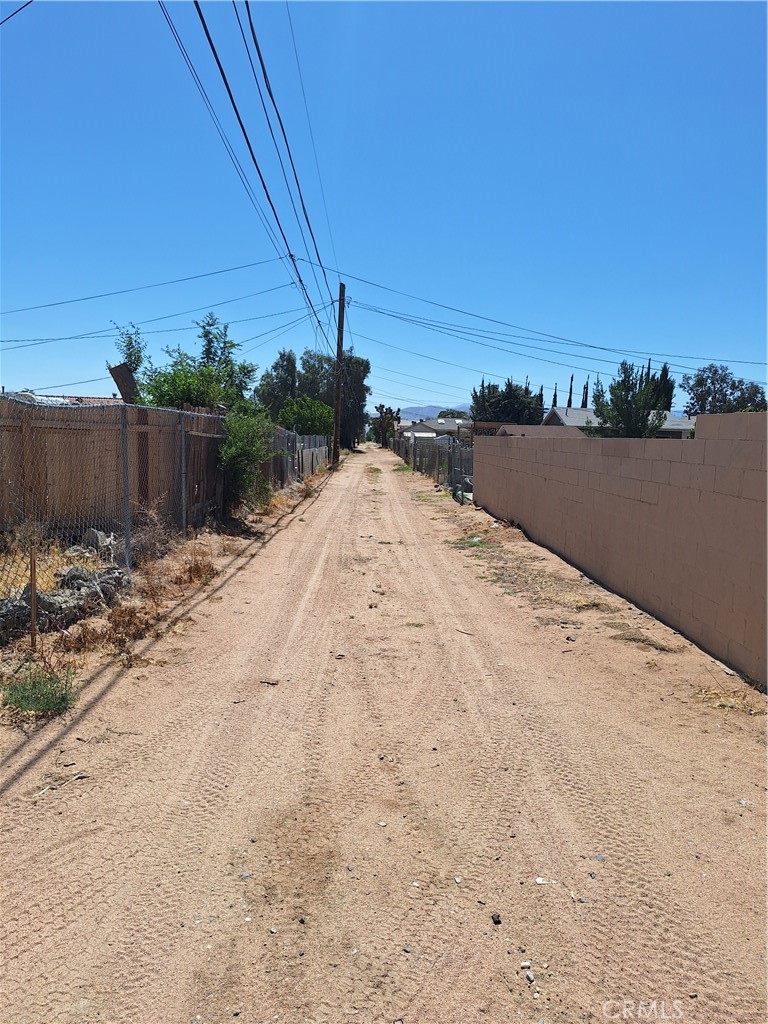 Situated in the rapidly developing High Desert area of Hesperia, CA, this prime vacant lot offers immense potential zoned Residential & Mixed-Use. Ideally located near the 15 Freeway and surrounded by highly-rated schools, popular restaurants, shopping, and community amenities, this parcel is at the heart of a promising growth corridor. Many large projects are in the works coming to the High Desert including the exciting addition of Brightline West’s all-electric high-speed rail, set to connect Las Vegas with California through stations in Apple Valley, Hesperia, and Rancho Cucamonga, this location stands poised for future prosperity and increased accessibility. Utilities are located near the property. The Mixed-Use zoning provides flexibility and potential for a range of uses, making it perfect for those looking to invest in an area with residential charm and commercial possibilities. This zoning encourages single-family residences.