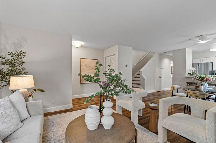 Discover elegance and comfort in this rare private end unit. This fully remodeled gem offers a sophisticated living experience. Sunlight dances through the spacious living areas, accentuating the open concept layout & main level bedroom. The kitchen boasts fresh white cabinetry with a chic stainless steel refrigerator, dishwasher, microwave, & a modern electric range. Quartz countertops & a convenient pantry cabinet complete this gourmet space. The luxury vinyl floors provide an elegant underfoot feel throughout, complemented by fresh paint. Upstairs, generously sized bedrooms feature custom organizers and access to two private balconies, perfect for relaxation. The large patio invites your green thumb forward, while the updated bathrooms and in-unit washer and dryer ensure convenience. Benefit from the security of two dedicated parking spaces in a gated underground area, enhanced by a Ring doorbell and floodlight camera. The community features a pool for leisurely afternoons & HOA dues covering water, garbage, & exterior maintenance. Positioned in a prime location, this home offers a serene escape amidst beautiful shade trees while being in one of Silicon Valley's most connected areas. An exquisite opportunity awaits you. Simply move in and start enjoying your new lifestyle