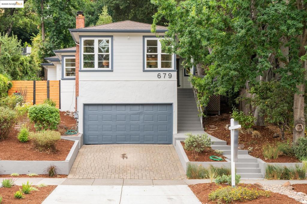 Delightful 3BR/2BA charmer in Oakland's beloved Crocker Highlands neighborhood. Nestled amongst the trees this home offers the perfect blend of privacy and community connection, with a WalkScore of 95! Inviting front porch leads inside to the bright and sunny living room, set up from the street for privacy, with custom built-ins and cozy wood burning fireplace. Hardwood floors throughout provide warmth and continuity. Updated kitchen with solid surface counters, stainless steel appliances, and an eating area to handle everything from morning coffee to dinner parties. But here's the real magic - your lovely terraced backyard backs directly to Oak Grove Park with a walking trail which is right on the way to Crocker Highlands Elementary School. Having no rear neighbor means pure tranquility and a connection to nature, while the uber convenient location puts Lakeshore Ave's shops and cafes just a couple of blocks away. The two car garage with 220V outlet ready for an EV charger, interior access and extra off-street parking solves city living's biggest challenge. This isn't just a house—it's your perfect balance of urban convenience, natural beauty, and neighborhood charm all wrapped into one irresistible Crocker Highlands package.