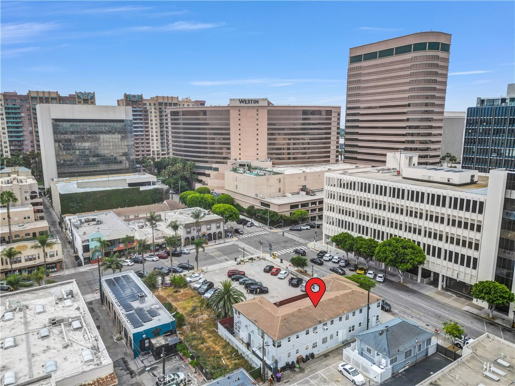 NEW PRICE IMPROVEMENT . . . Welcome to your serene city escape, tucked into the vibrant tapestry of downtown Long Beach. condominium Unit 9 at Grayson Arms is more than a studio—it’s a portal into the soul of the East Village Arts District, where creativity meets convenience, and history blends with modern energy.
Located on the second floor of a classic mid-century building, this bright and airy studio is filled with natural light. Oversized windows frame views of the landscaped courtyard and urban streetscape, setting the mood for mornings with coffee or quiet evenings in.
Inside, you’ll find:
A spacious walk-in closet + additional mirrored closet
A large eat-in kitchen with plentiful cabinetry
Newer gas stove, refrigerator, and designer paint
A window AC unit and gas wall heater for year-round comfort
Mini blinds and updated plumbing fixtures throughout
But what truly sets this property apart is its location. Just steps away from the Blue Line Metro, Shoreline Village, Terrace Theater, Pine Ave restaurants, The Pike, art galleries, and boutique cafés—you’re in the creative core of Long Beach. And with ongoing revitalization all around—luxury developments, reimagined public spaces, and expanded dining—you’re not just buying a home; you’re stepping into the future of the city.
With a Walk Score of 97, a pet-friendly HOA, on-site laundry, and rental parking nearby, life here is effortless.
Whether you’re an artist, investor, or dreamer looking for a place that reflects your vibe, Unit 9 offers charm, connection, and a canvas to create the life you want.
Make your mark in East Village.