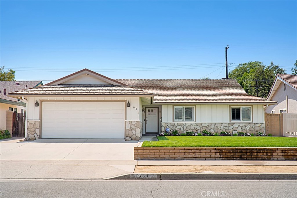 Location, Location, Location! Welcome home to this beautifully remodeled single-story ranch-style gem! Featuring 3 spacious bedrooms and 2 full bathrooms, this turnkey property is move-in ready and waiting for you. You'll love the professionally landscaped front and back yard, offering great curb appeal and space to enjoy the outdoors. Step inside to find a stunning, newly designed kitchen with modern cabinetry throughout—including custom storage in the garage for added convenience. The vaulted ceilings and open-concept living and family room create the perfect layout for relaxing or entertaining guests. The primary suite includes a generously sized walk-in closet with built-in shelving for optimal organization. Additional features include: Hardwood and tile flooring throughout – no carpet! Fresh interior paint. Dual-pane windows for energy efficiency. A relatively new, high-performance AC unit. A versatile backyard shed—ideal for lawn tools, or easily converted into a stylish he-shed or she-shed.