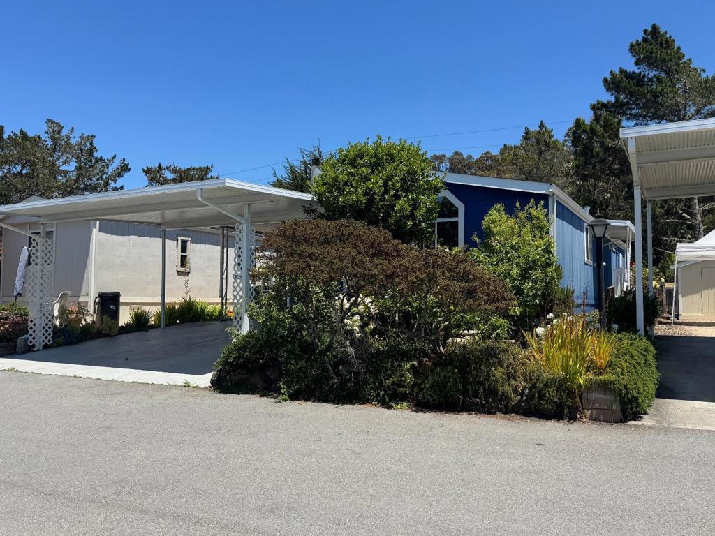 This two-bedroom, two-bathroom mobile home offers approximately 1,248 square feet of living space. The primary bedroom features ample storage with a walk-in closet. The secondary bedroom provides a comfortable space for guests or an office. The home's layout includes a living room that seamlessly flows into the dining area, creating a welcoming and open floor plan. The kitchen is equipped with granite counters and dining bar, providing a functional workspace for meal preparation. The home's bathrooms are well-appointed, with modern fixtures and finishes. Situated on a sizable lot, this property offers the potential for the gardening enthusiast. Canada Cove is a community filled with activities: Outdoor, seasonal, saline, heated pool, Club house, volunteer opportunities, Bocce Ball, Billiards, exercise room with great equipment, trails and beach access!