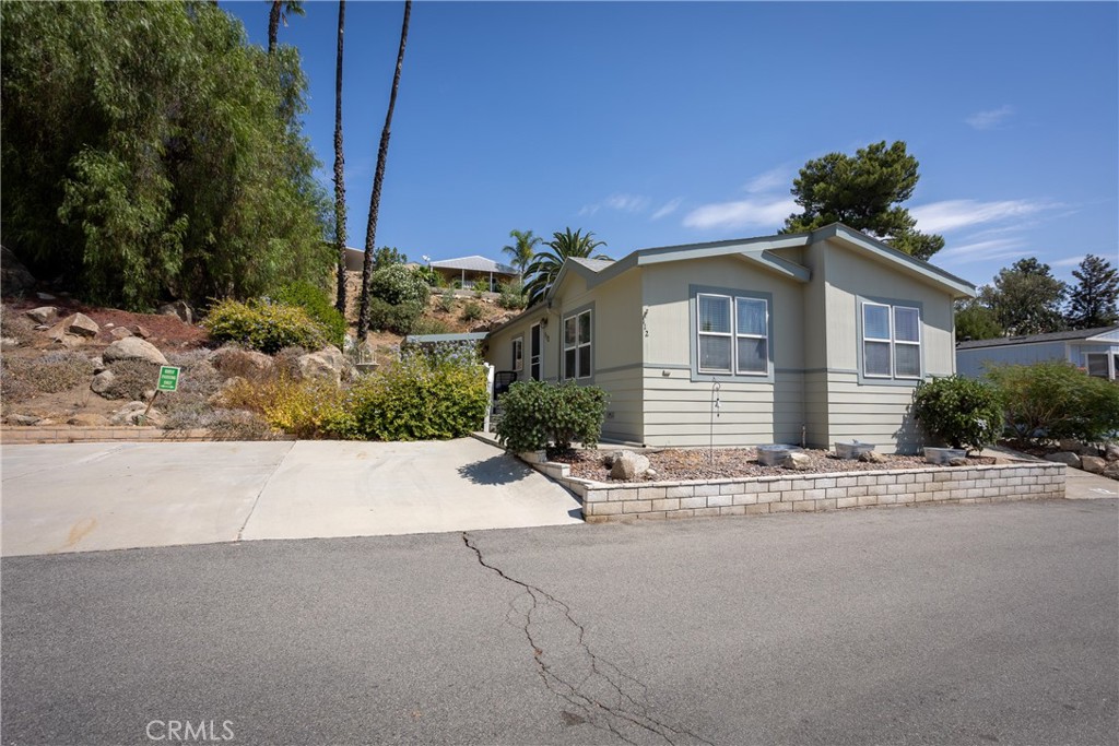 Welcome to this exquisitely decorated, move in ready home, fully upgraded. featuring two spacious bedrooms and two bathrooms. The sunny and bright, kitchen with white cabinets throughout is a delight, with light and elegant wood floors. The dining room is adjacent to the kitchen for easy entertainment. The master alcove is at the end of the hallway featuring and master bathroom with an ample linen cabinet. The private dressing room is connecting to the bedroom for your privacy and convenience. Second bedroom is use as an elegant office right now. The guest bathroom is off the hallway, by the fully equipped laundry room. The elegant living room is a dream for conversation and entertaining. This home has elegant wood floors throughout except the bedrooms, with ceiling fans in all the rooms. Step outside to the fully landscape yard with rock formations and lots of plants. The patio is great for relaxing with the soothing sounds of the water cascade close by. The patio is partly cover for those sunny days. You are welcome by the stone steps at the entrance of this lovely home. The back yard features a shed that will stay with the property. A pleasure to show. Seller has secure a property and there are not contingencies. Occupancy is fast. Bring your fussiest buyer you will not be disappointed.
